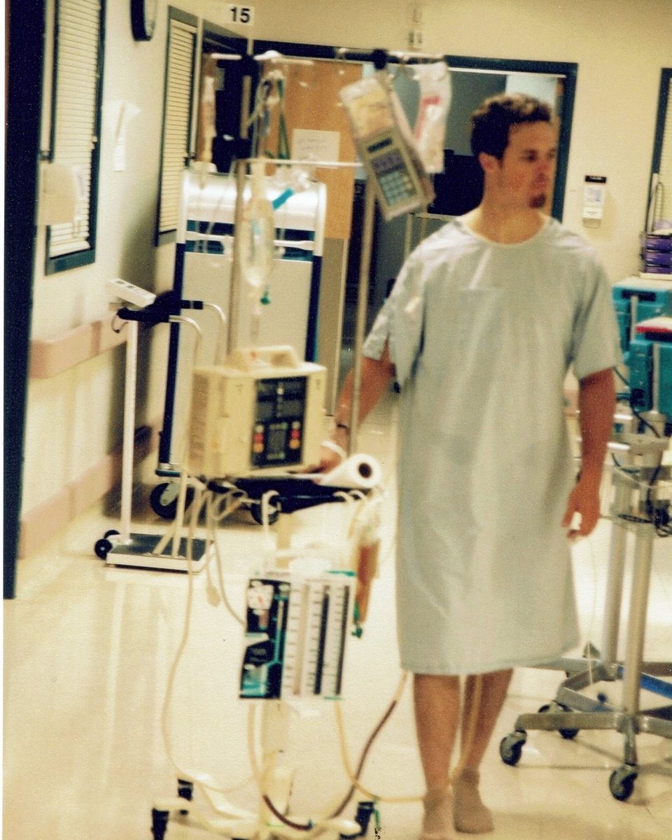 Brickman walking in the hospital during recovery